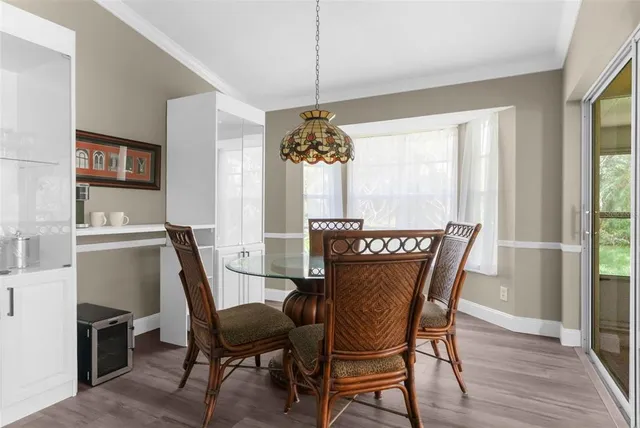 a view of a dining room with furniture and window
