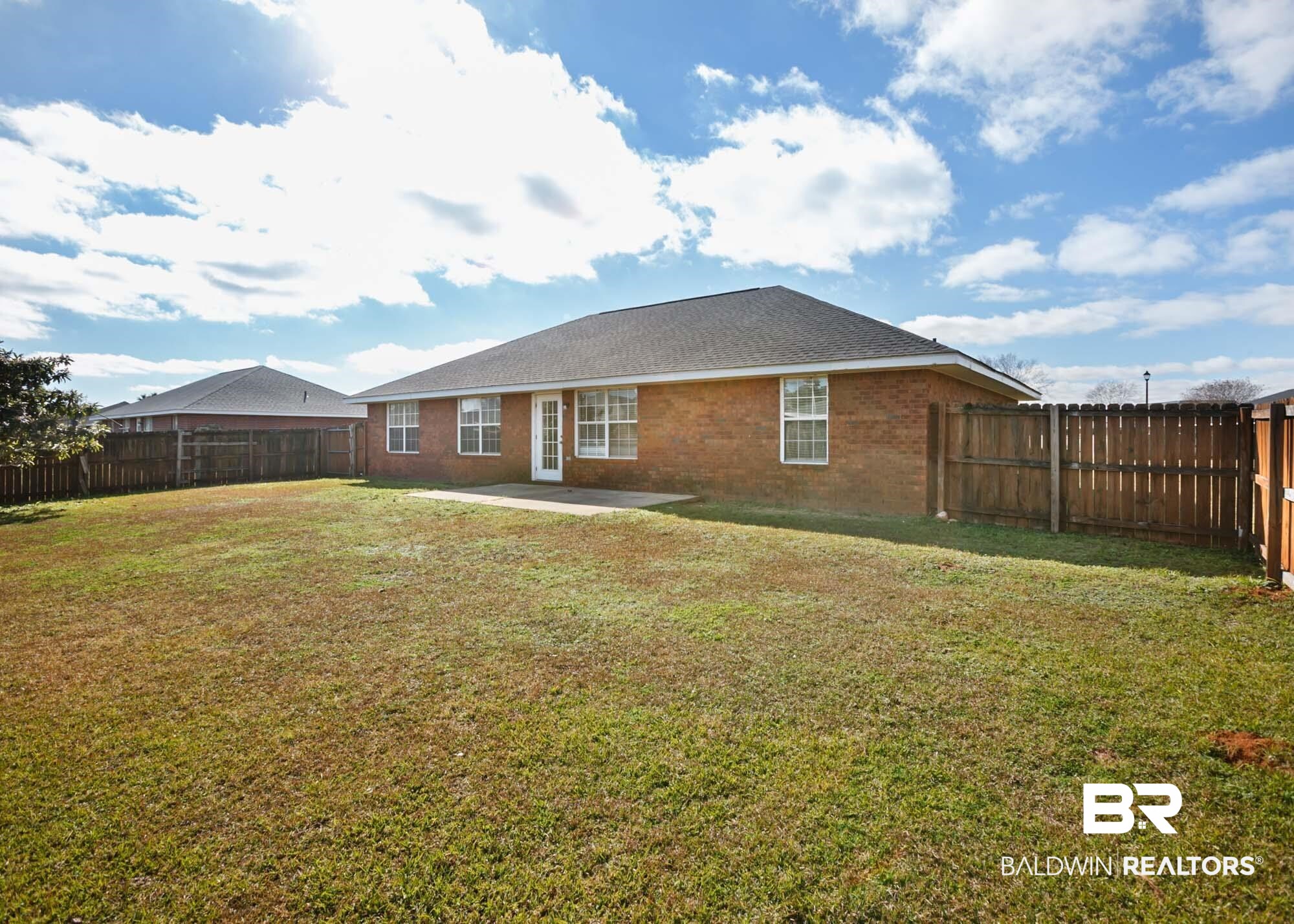 2530 Ashburn Lane Foley, AL 36535 - Photo 4 of 46 Rear view of property featuring a yard and a patio area