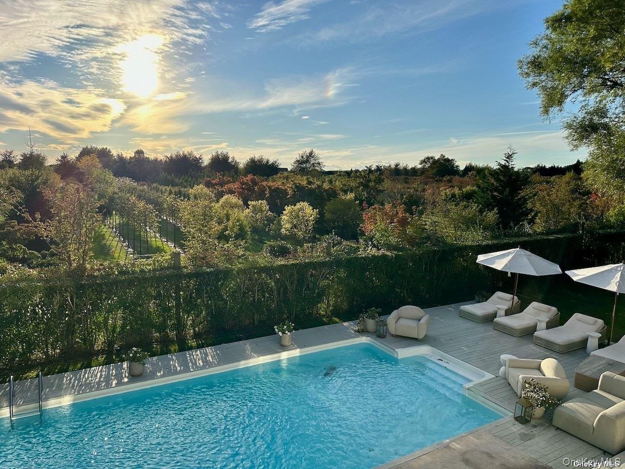 62 Sea Farm Lane Bridgehampton, NY 11932 - Photo 1 of 25 a view of a lake with a yard