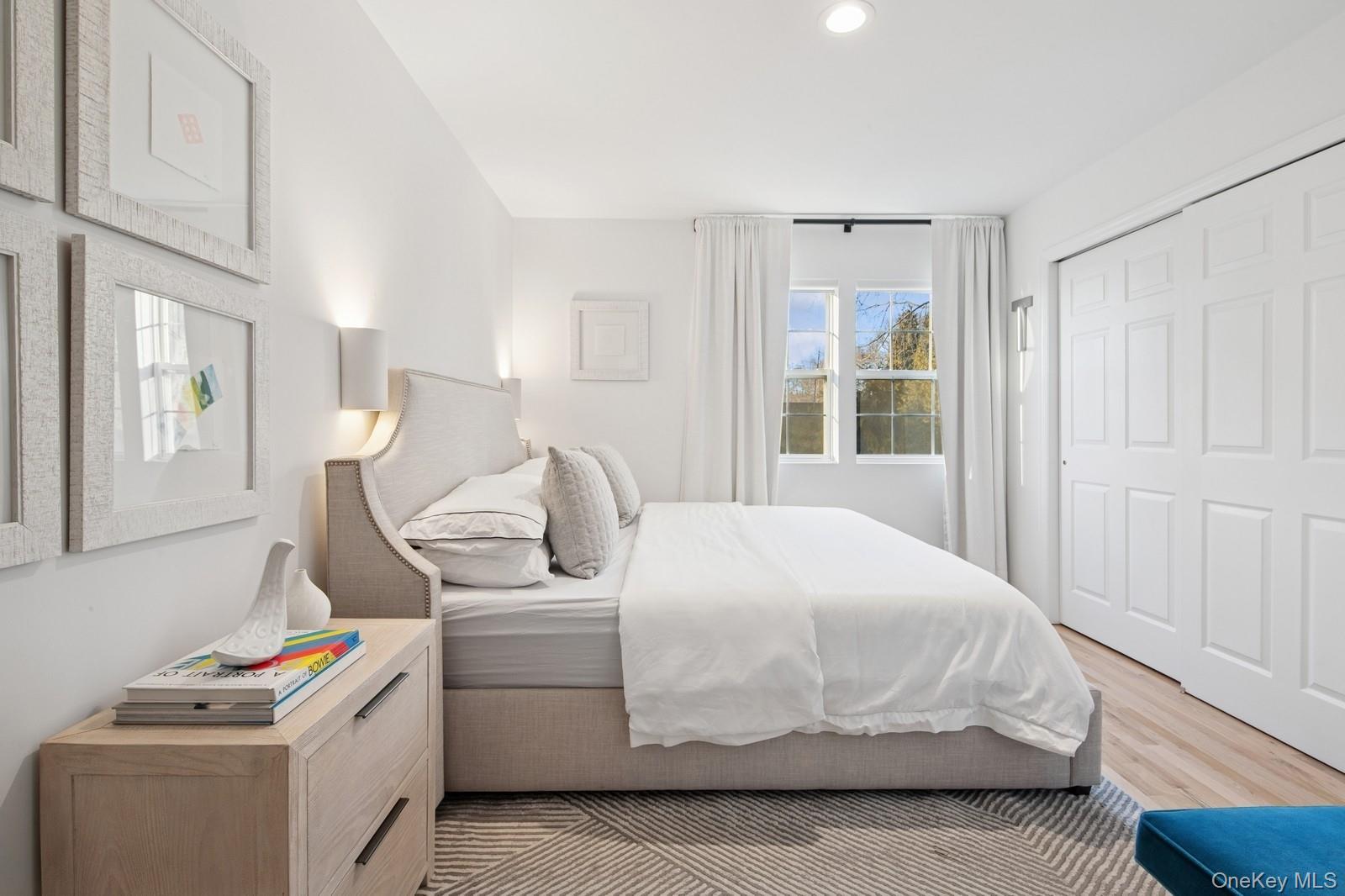 62 Sea Farm Lane Bridgehampton, NY 11932 - Photo 11 of 25 a bedroom with a bed and a window