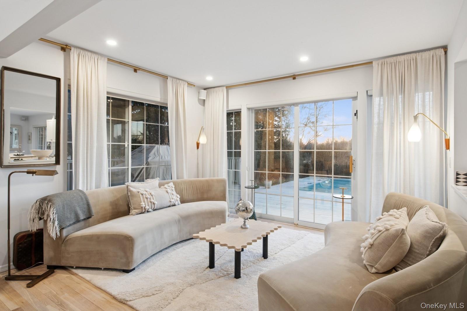 62 Sea Farm Lane Bridgehampton, NY 11932 - Photo 3 of 25 a living room with furniture and a large window