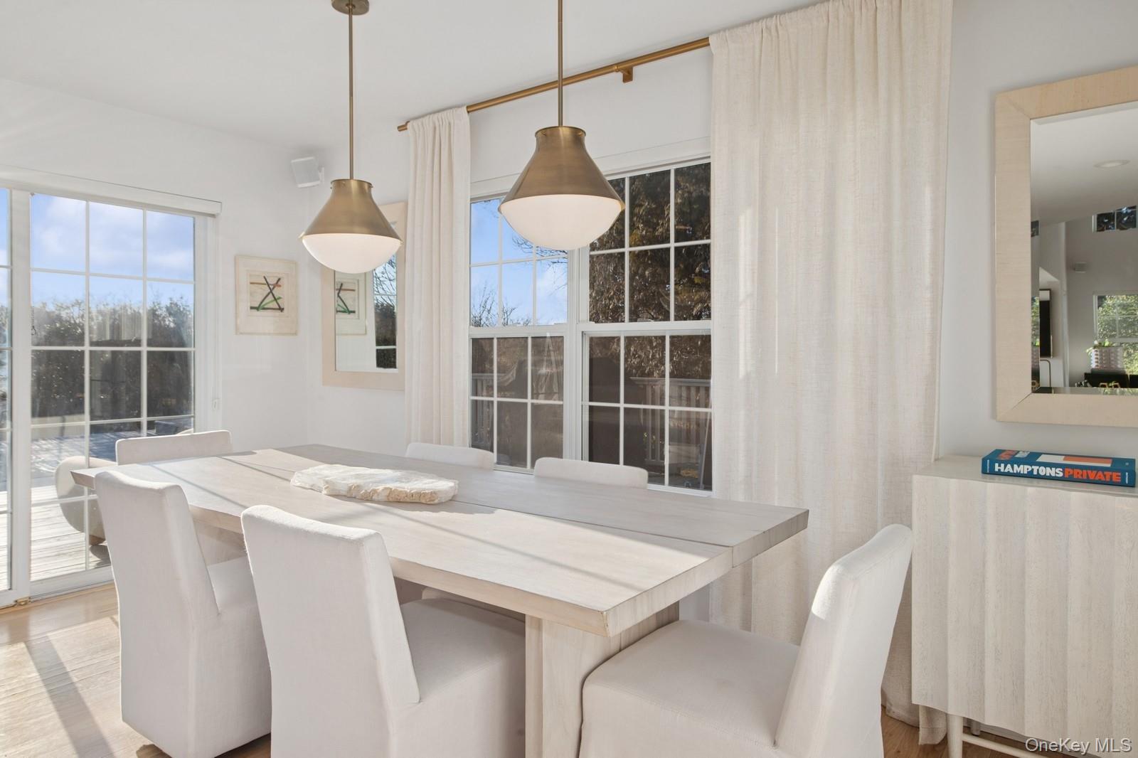62 Sea Farm Lane Bridgehampton, NY 11932 - Photo 6 of 25 a kitchen with a table and chairs