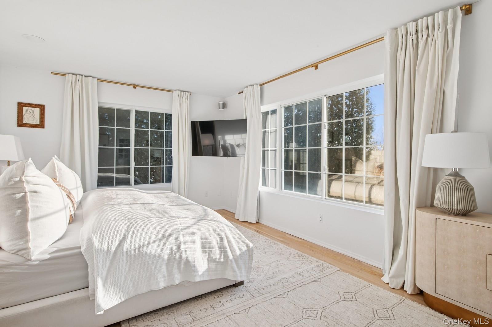 62 Sea Farm Lane Bridgehampton, NY 11932 - Photo 9 of 25 a bedroom with a bed and a window