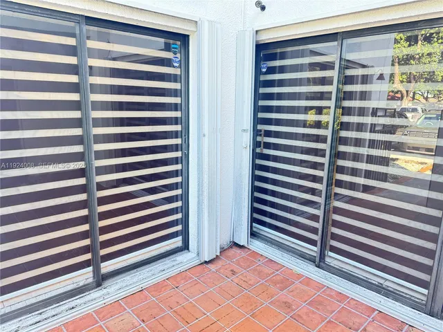 a view of a room with a window and stairs