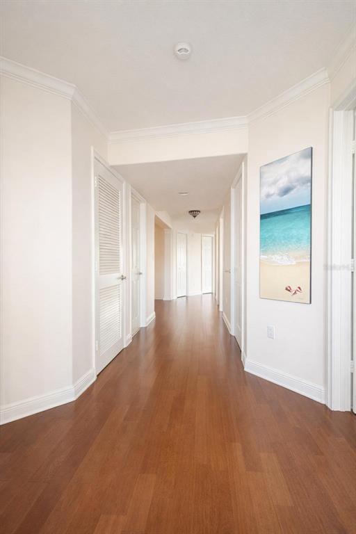 420 Harding Avenue, Unit 301 Cocoa Beach, FL 32931 - Photo 16 of 57 a view of an empty room with wooden floor