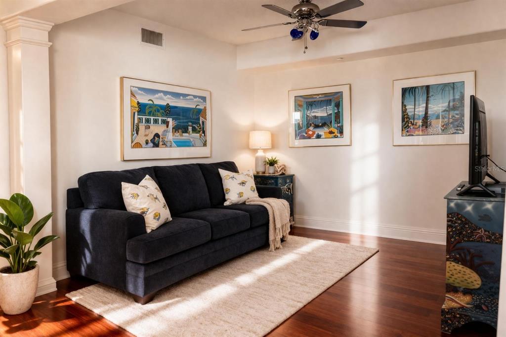 420 Harding Avenue, Unit 301 Cocoa Beach, FL 32931 - Photo 17 of 57 a living room with furniture and a potted plant