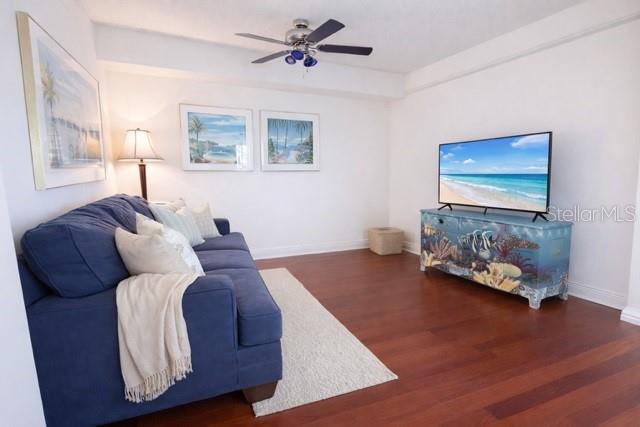 420 Harding Avenue, Unit 301 Cocoa Beach, FL 32931 - Photo 18 of 57 a bed room with a bed and a couch