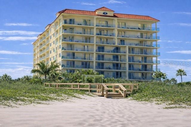 420 Harding Avenue, Unit 301 Cocoa Beach, FL 32931 - Photo 2 of 57 a view of a tall building