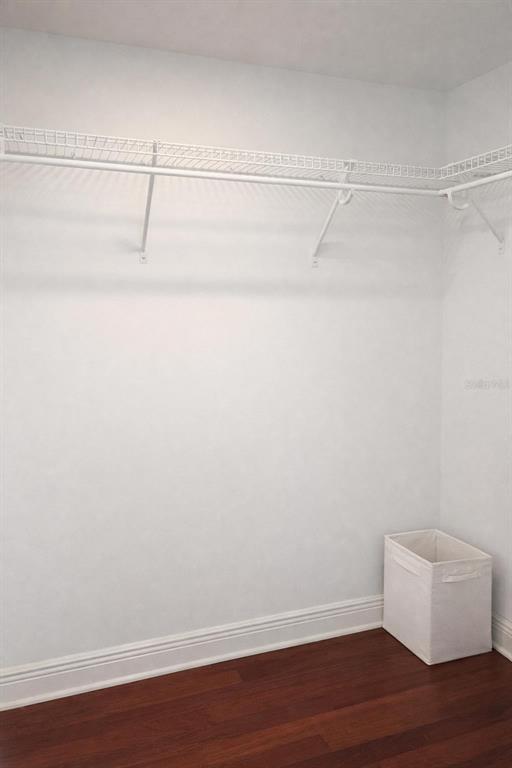 420 Harding Avenue, Unit 301 Cocoa Beach, FL 32931 - Photo 23 of 57 a view of a room with an empty racks