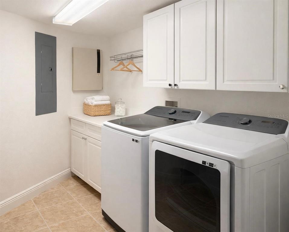 420 Harding Avenue, Unit 301 Cocoa Beach, FL 32931 - Photo 24 of 57 a utility room with dryer and washer