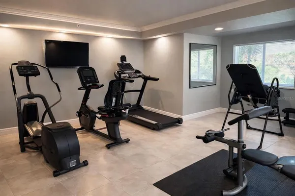 a kitchen with stainless steel appliances a stove a microwave a sink and a microwave