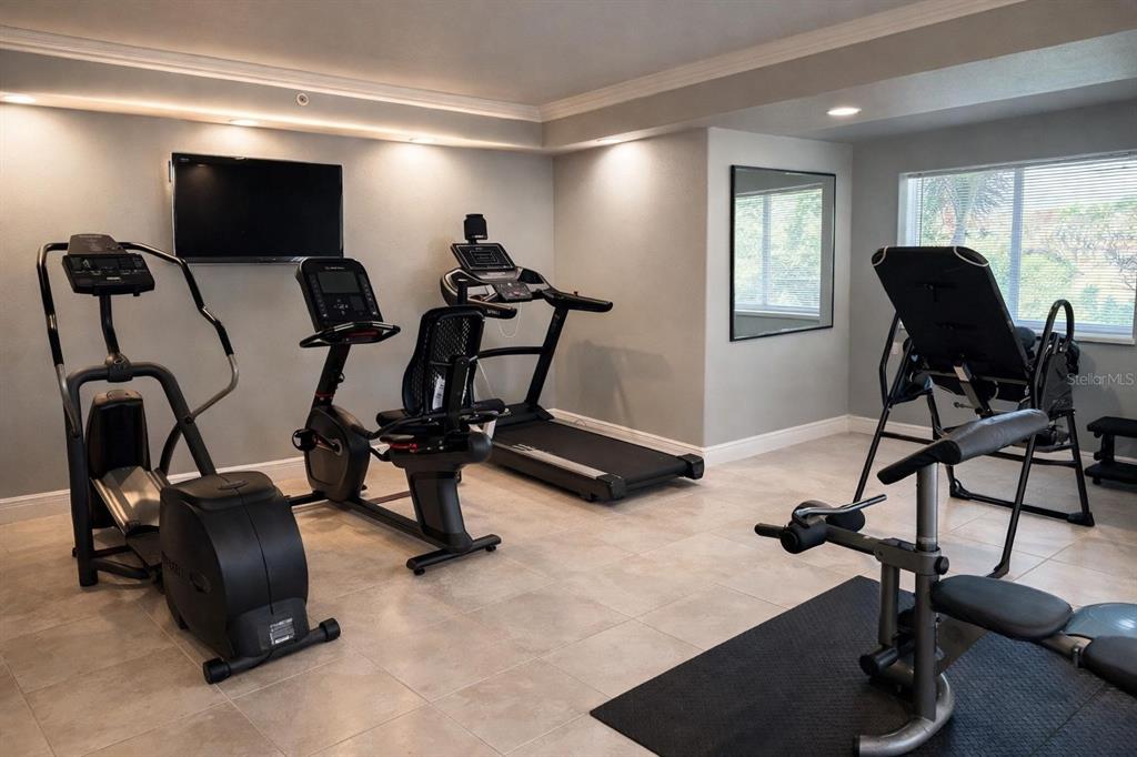 420 Harding Avenue, Unit 301 Cocoa Beach, FL 32931 - Photo 38 of 57 a view of a workspace with furniture and a window