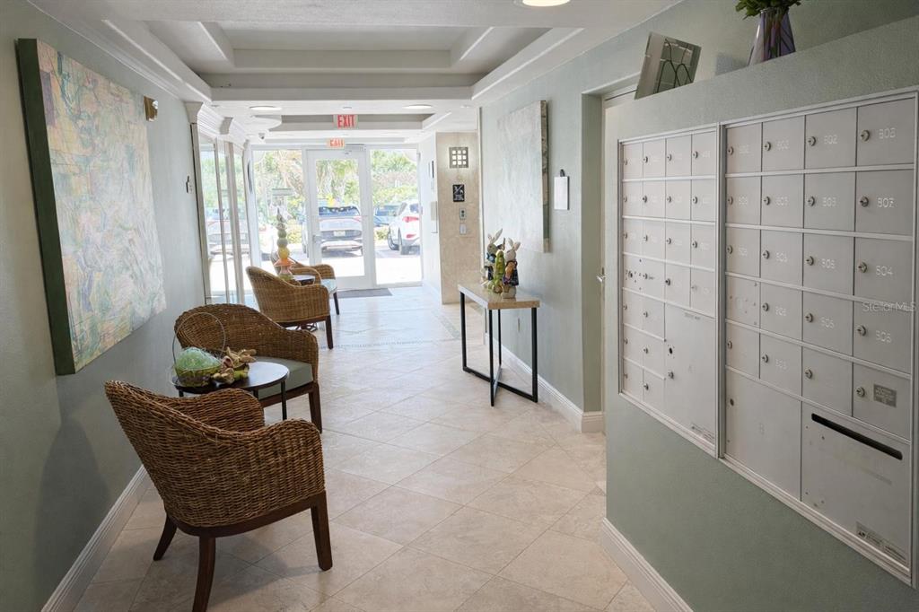 420 Harding Avenue, Unit 301 Cocoa Beach, FL 32931 - Photo 46 of 57 a living room with furniture and a large window