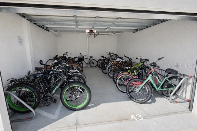 420 Harding Avenue, Unit 301 Cocoa Beach, FL 32931 - Photo 49 of 57 a view of a garage with a bike parked