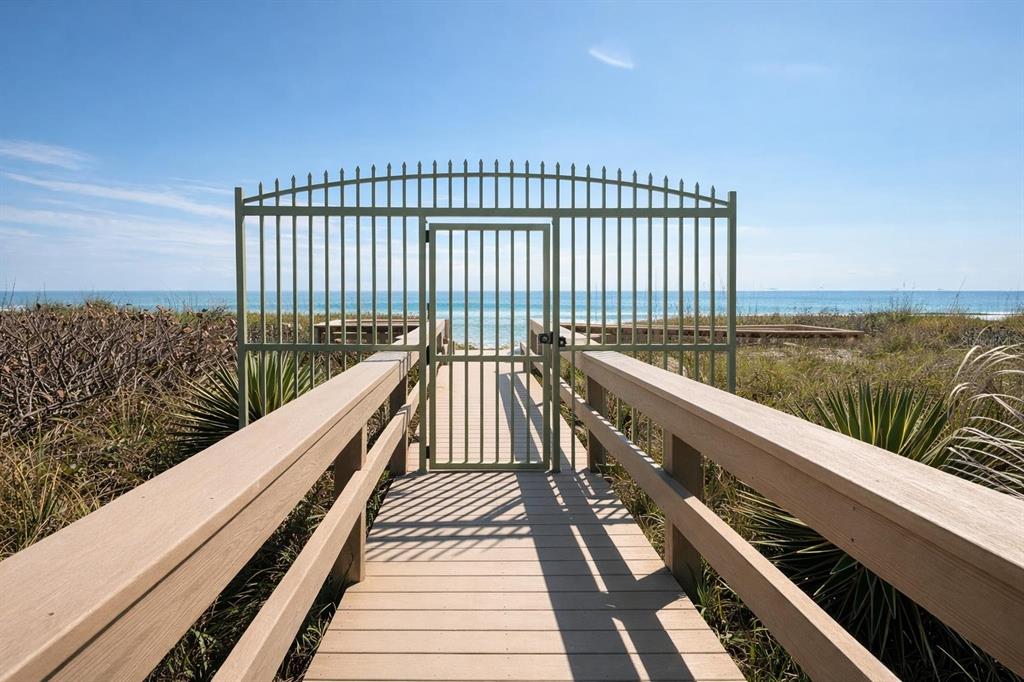 420 Harding Avenue, Unit 301 Cocoa Beach, FL 32931 - Photo 53 of 57 a view of balcony and floor with wooden floor and fence
