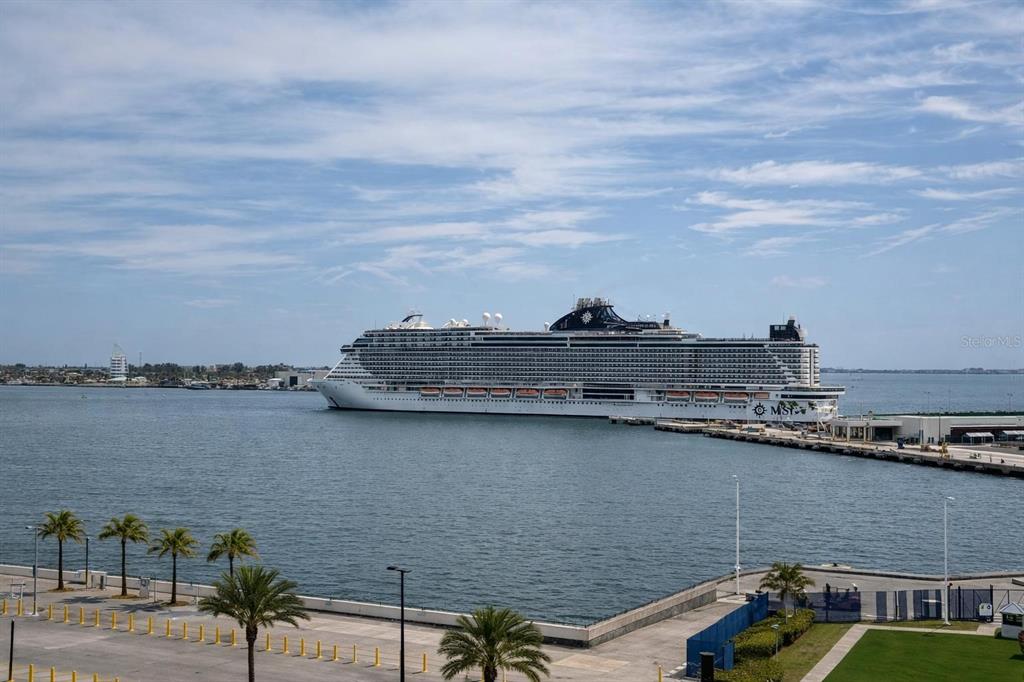 420 Harding Avenue, Unit 301 Cocoa Beach, FL 32931 - Photo 56 of 57 a terrace with a table and chairs