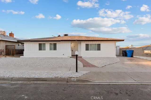 a front view of a house with yard