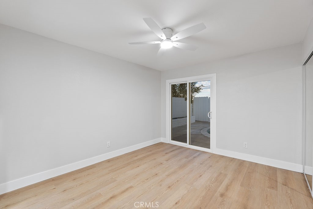 911 Keith Street Barstow, CA 92311 - Photo 18 of 40 a view of an empty room with wooden floor