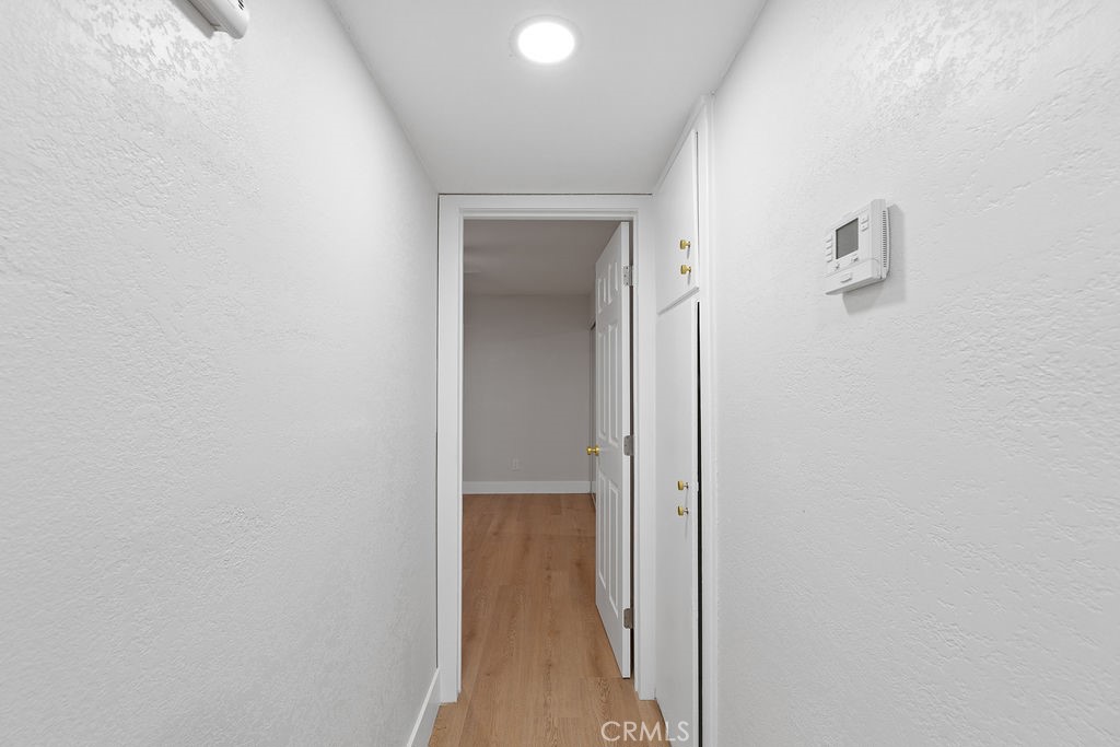 911 Keith Street Barstow, CA 92311 - Photo 25 of 40 a view of a hallway with wooden floor