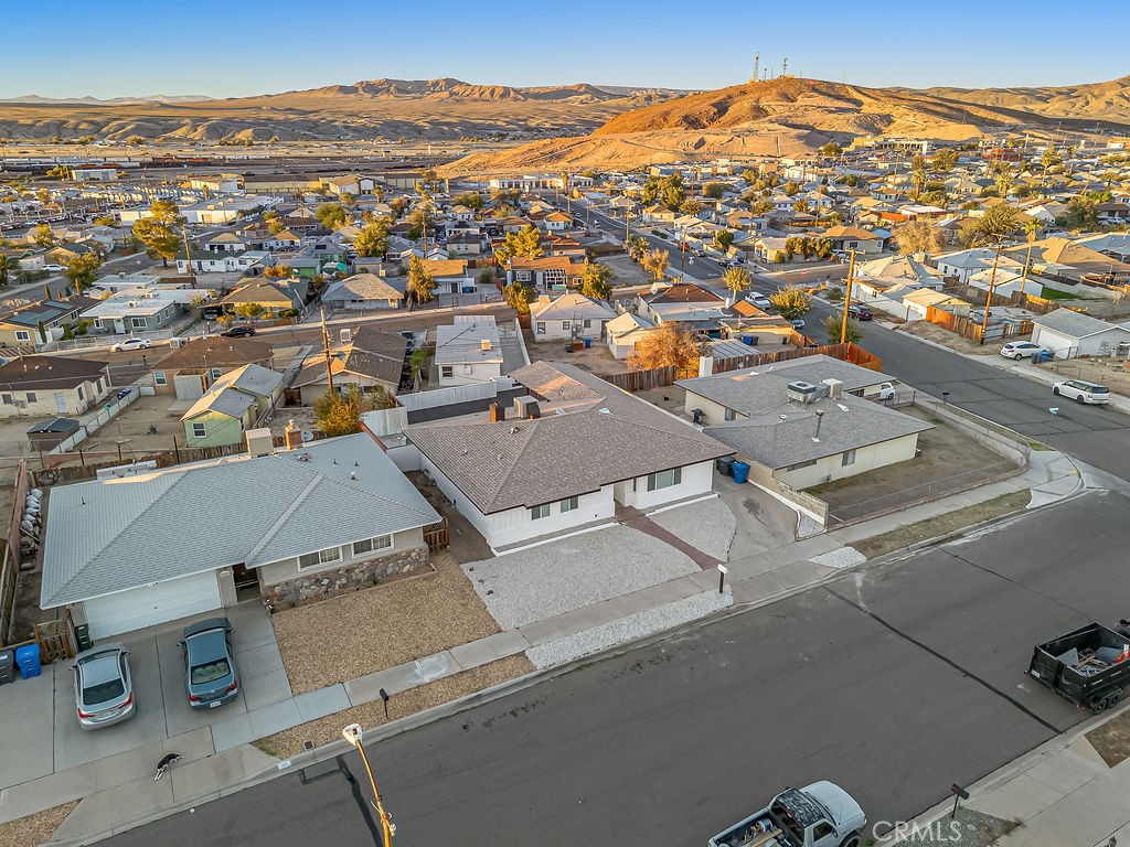 911 Keith Street Barstow, CA 92311 - Photo 38 of 40 an aerial view of residential houses with outdoor space