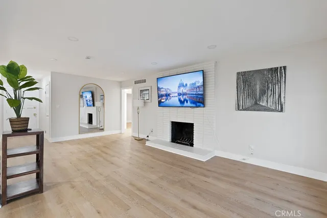 a view of a livingroom with furniture and a fireplace