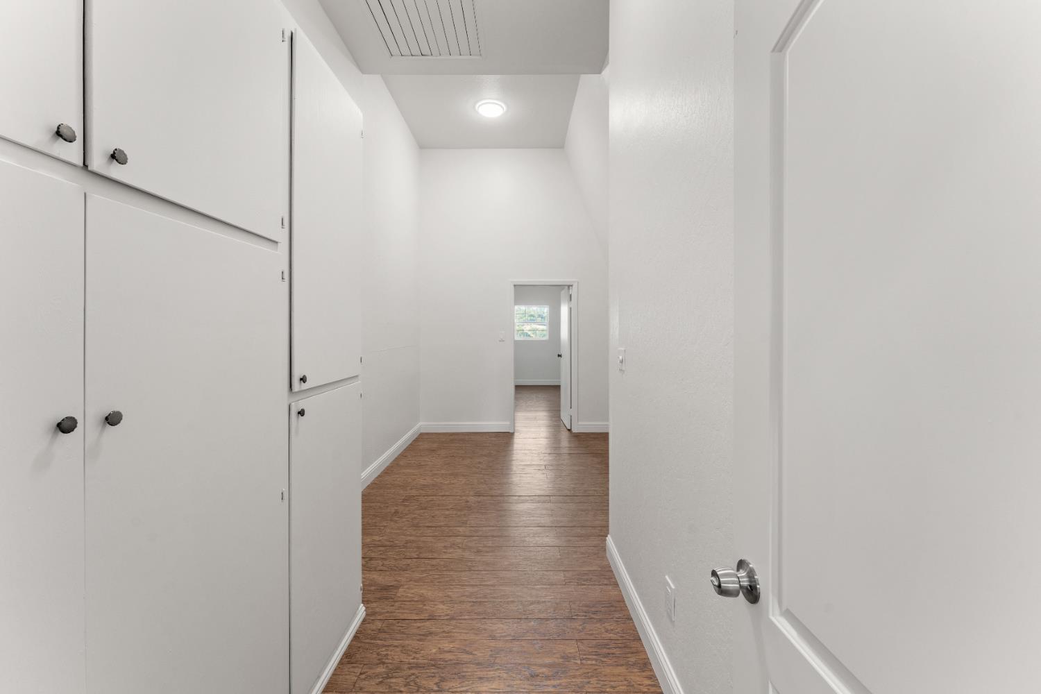 5585 Garden Bar Road, Unit 2 Lincoln, CA 95648 - Photo 17 of 65 a view of a hallway with wooden floor