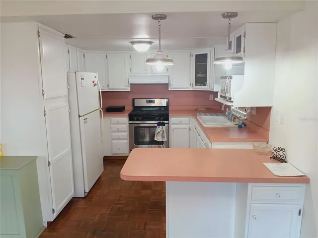 a bathroom with a sink toilet and a mirror