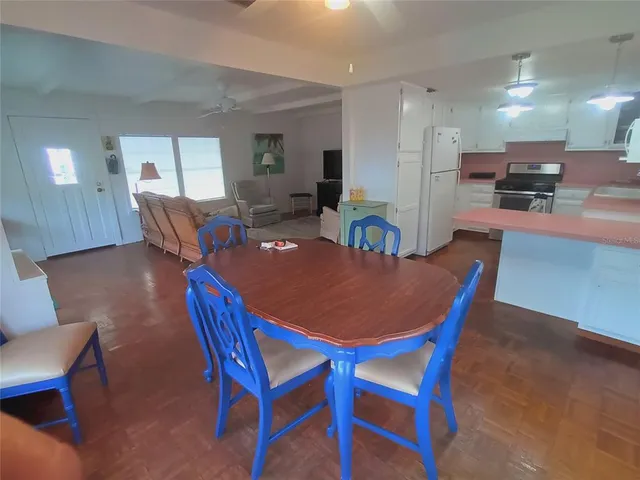 a bedroom with two beds and a table