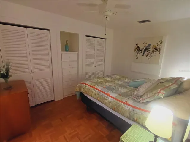 a living room with furniture a rug and a table