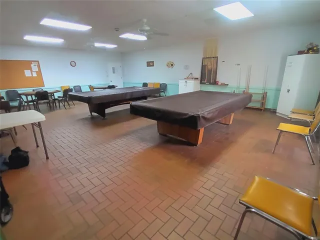 a view of a backyard with sitting area