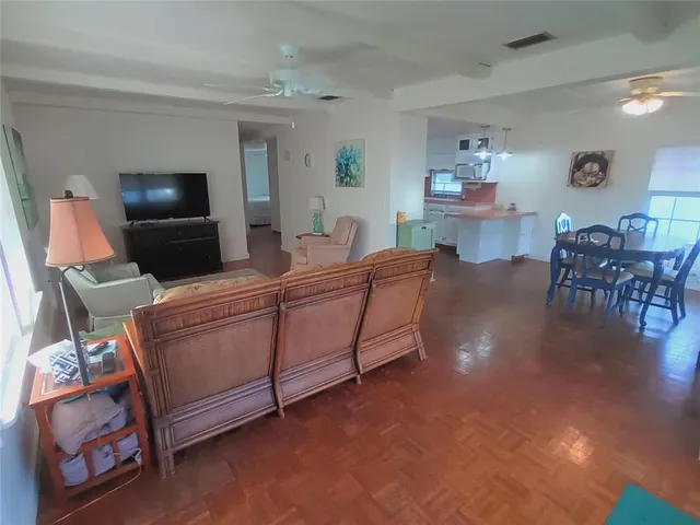 a kitchen with stainless steel appliances a stove a sink and a microwave