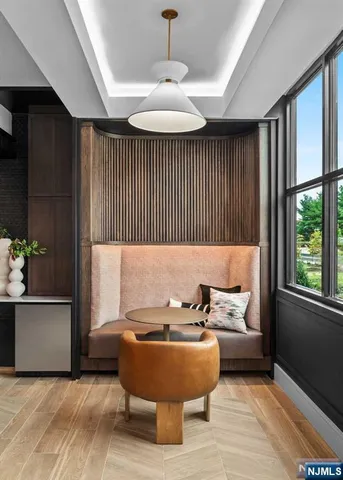 a balcony with furniture and wooden floor