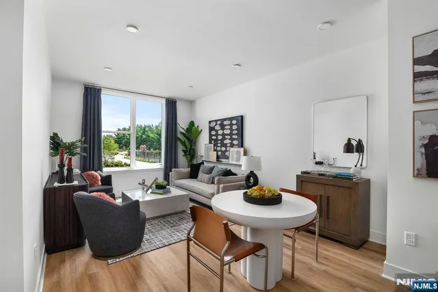 a kitchen with stainless steel appliances a refrigerator sink and microwave