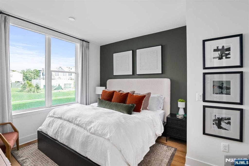 18 Park Avenue, Unit 1122 Old Tappan, NJ 07675 - Photo 26 of 33 a bedroom with a bed and a large window