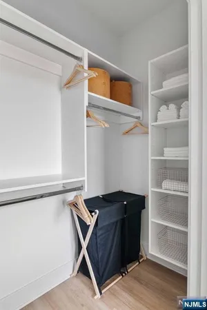 a view of a hallway with washer and dryer