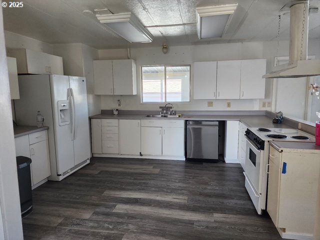 1199 North Terry Street, Unit 287 Eugene, OR 97402 - Photo 14 of 17 a kitchen with stainless steel appliances a sink a stove a refrigerator and white cabinets