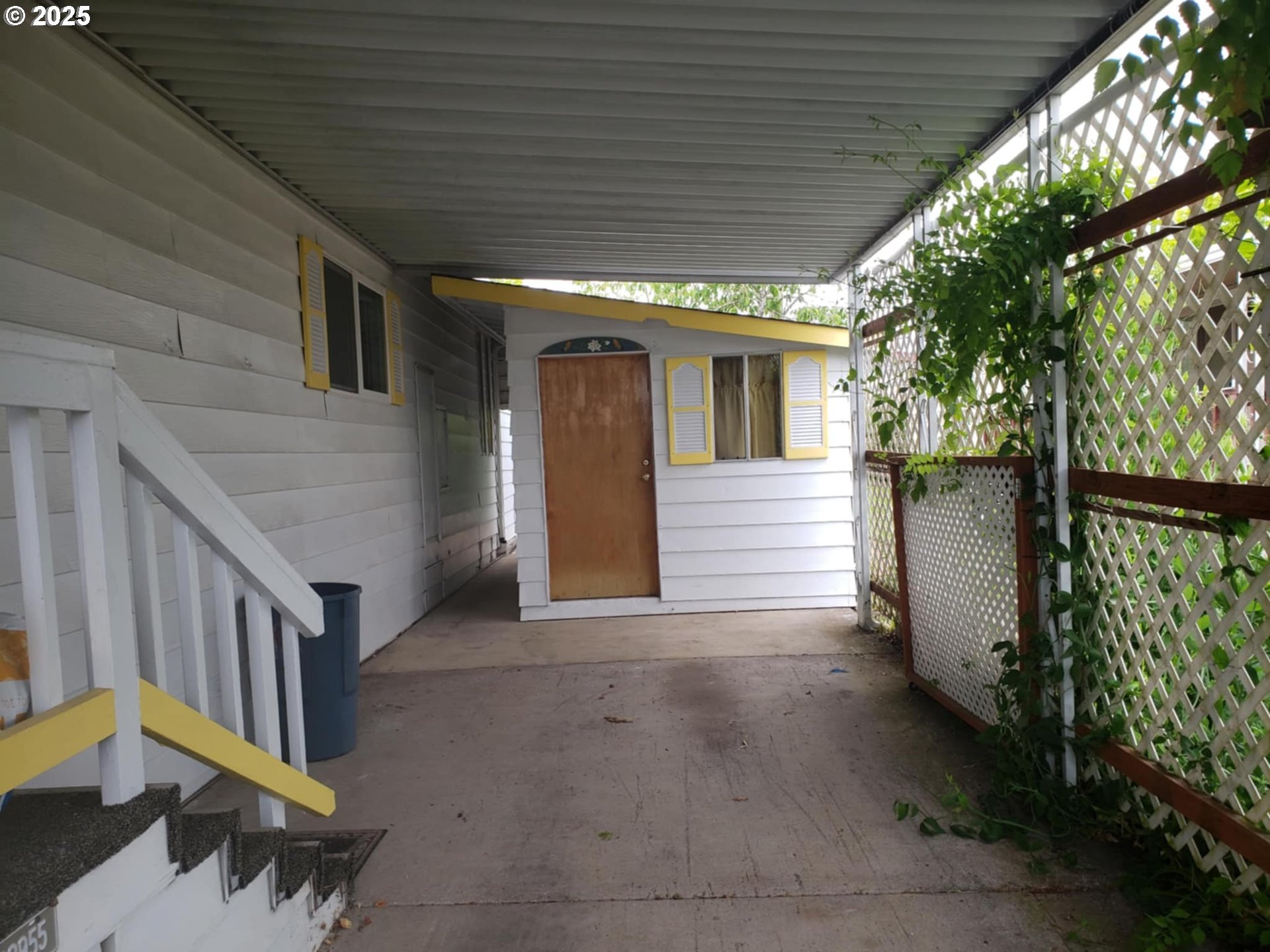 1199 North Terry Street, Unit 287 Eugene, OR 97402 - Photo 2 of 17 a view of a house with wooden fence