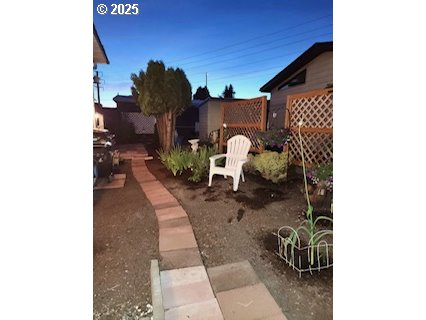 1199 North Terry Street, Unit 287 Eugene, OR 97402 - Photo 3 of 17 a picture of living room with furniture and a rug
