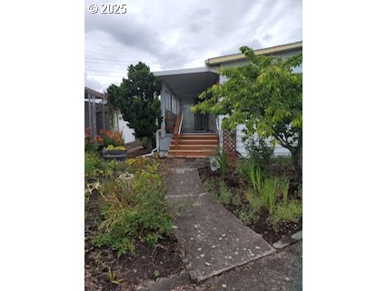 1199 North Terry Street, Unit 287 Eugene, OR 97402 - Photo 8 of 17 a view of a yard in front of a house