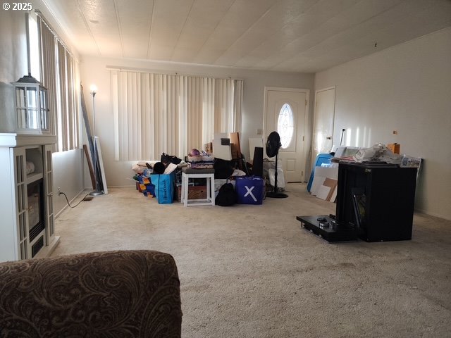 1199 North Terry Street, Unit 287 Eugene, OR 97402 - Photo 9 of 17 a living room with furniture and a window