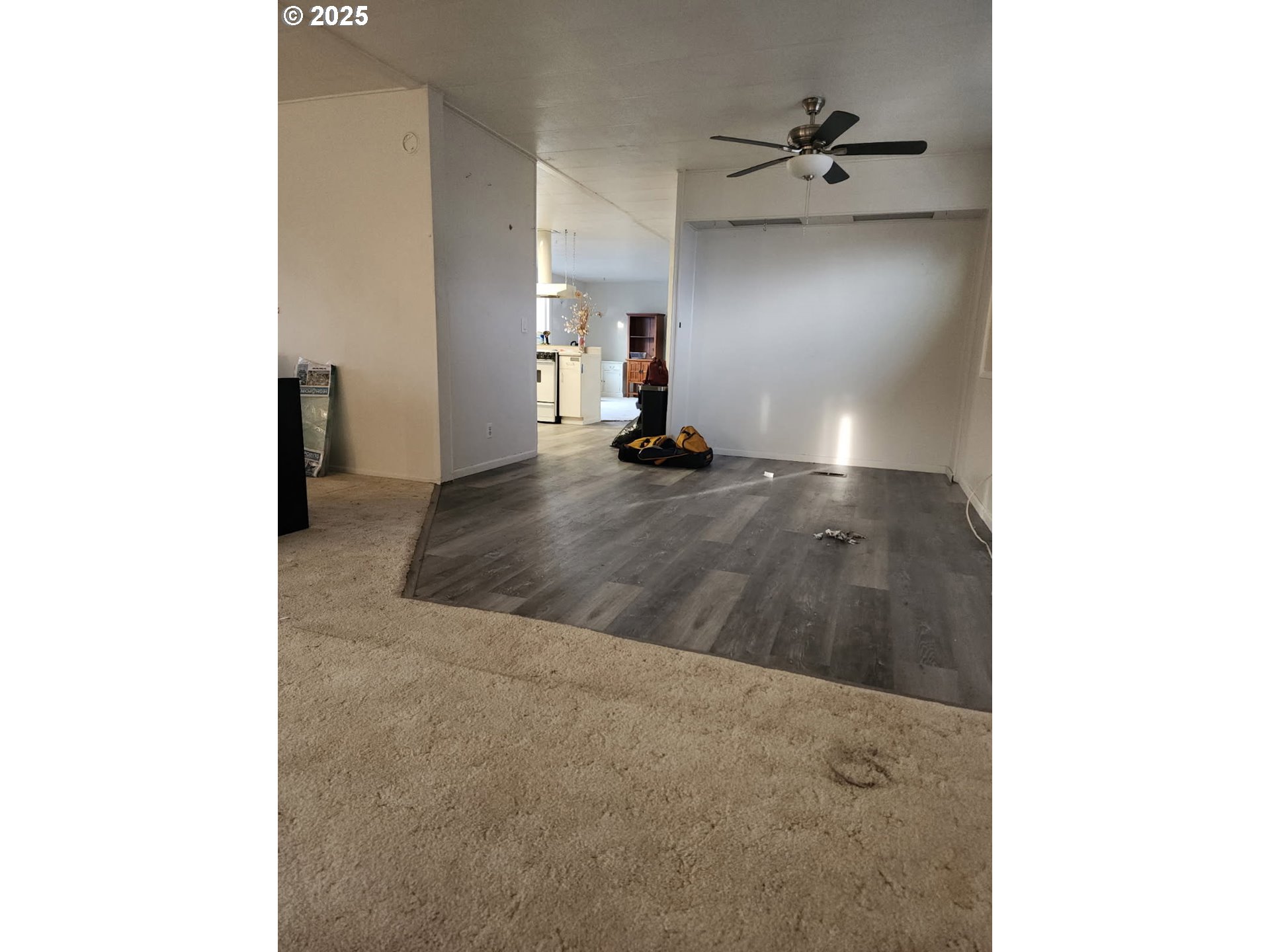 1199 North Terry Street, Unit 287 Eugene, OR 97402 - Photo 10 of 17 a view of a living room with a ceiling fan
