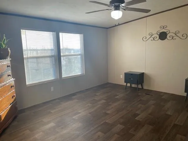 a bathroom with a granite countertop sink toilet and a mirror