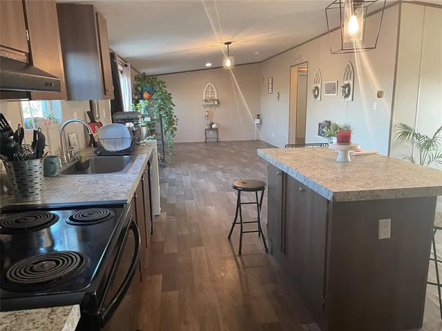 a kitchen with a table and chairs in it