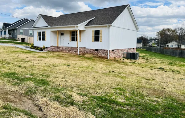 a swimming pool view with wooden fence