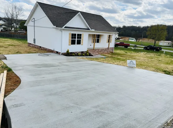 a view of a house with swimming pool and yard