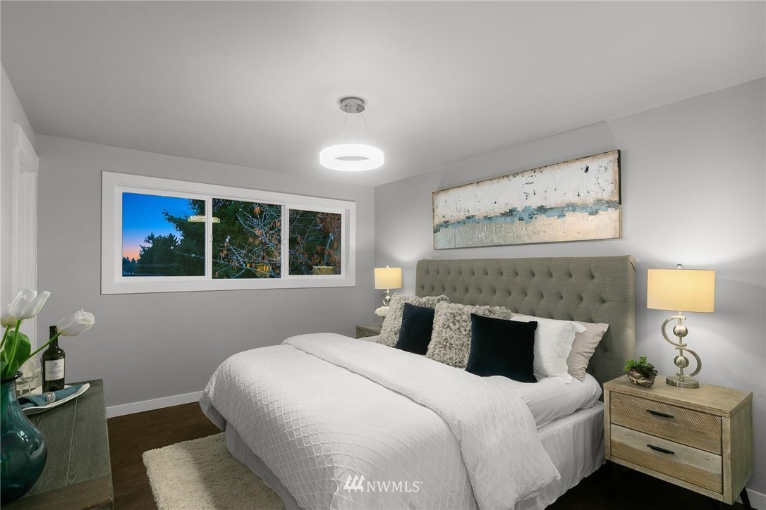 12110 Southeast 60th Place Bellevue, WA 98006 - Photo 13 of 32 a bedroom with a bed and window