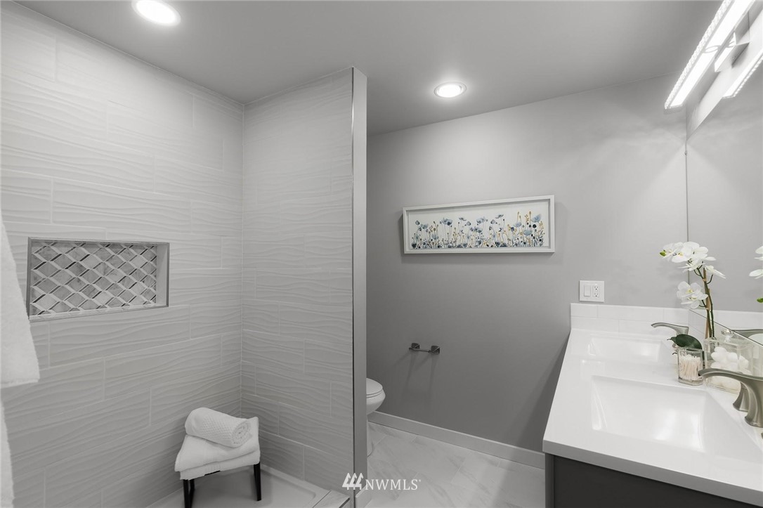 12110 Southeast 60th Place Bellevue, WA 98006 - Photo 14 of 32 a bathroom with a sink and a mirror