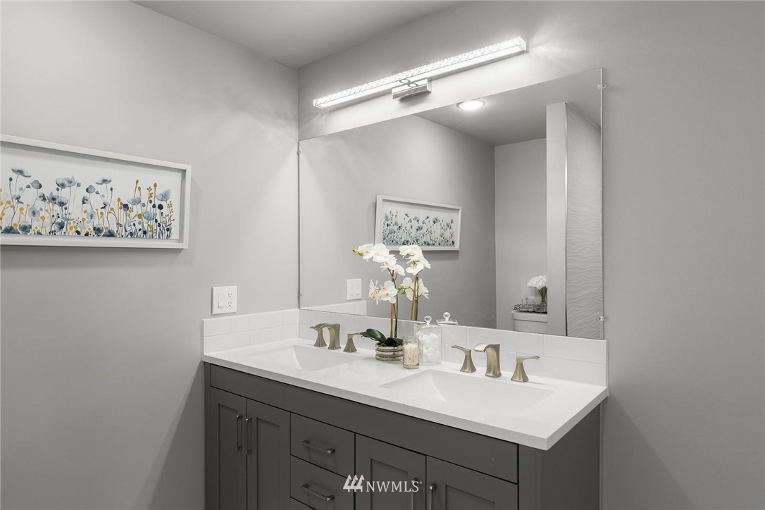 12110 Southeast 60th Place Bellevue, WA 98006 - Photo 16 of 32 a bathroom with a sink and a mirror