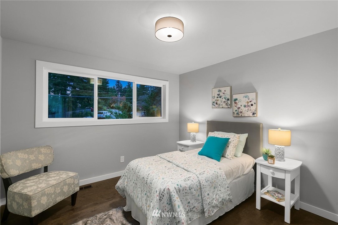 12110 Southeast 60th Place Bellevue, WA 98006 - Photo 17 of 32 a bedroom with a bed and window