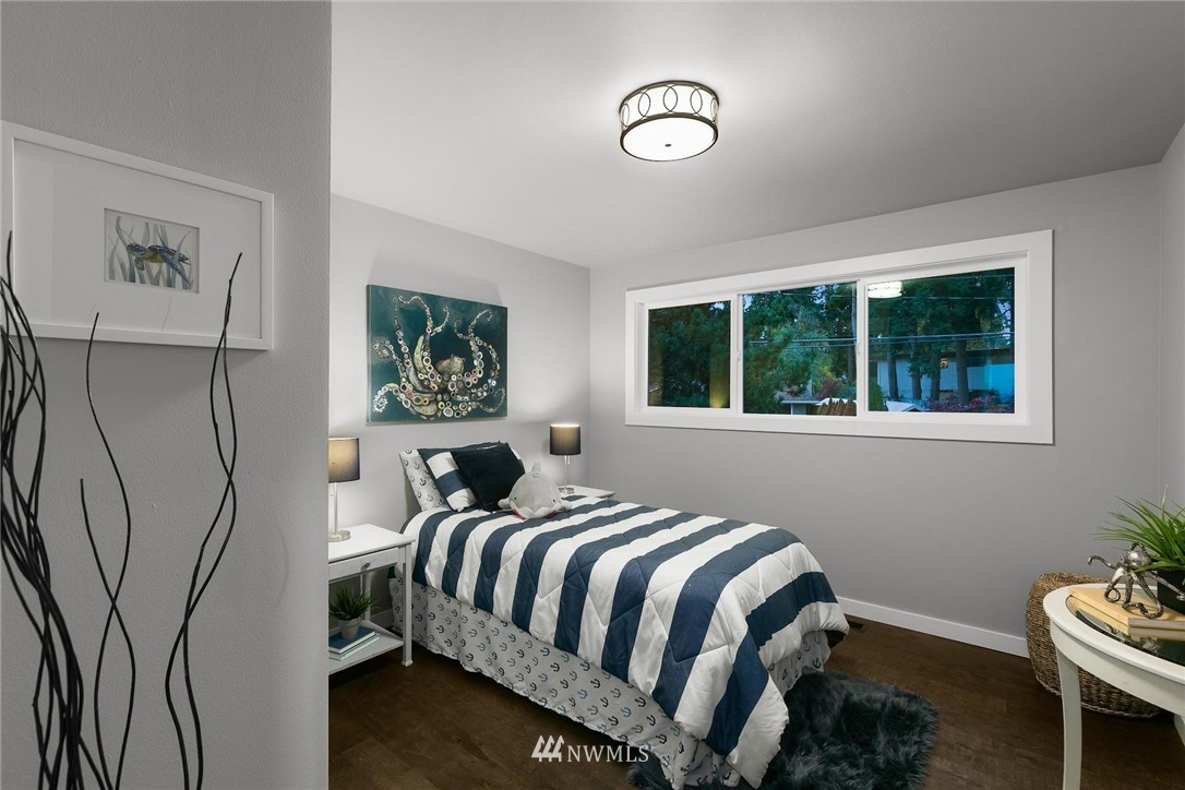 12110 Southeast 60th Place Bellevue, WA 98006 - Photo 19 of 32 a bedroom with a bed and a window